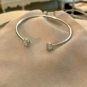 Bangle bracelet with opals in crown settings is a dainty bracelet!